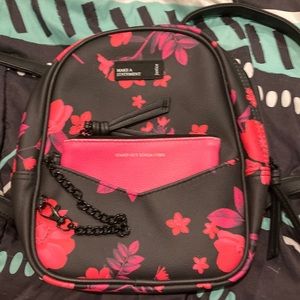 Mini justice backpack brand new condition never used